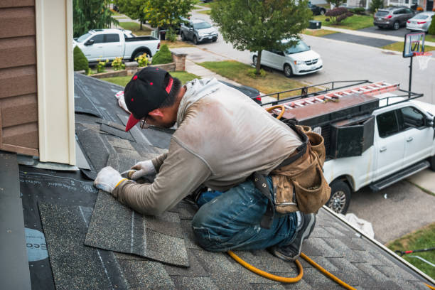 Professional Roofing technician working in Raymond, WA